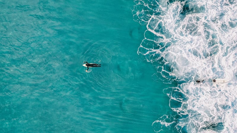 Surfer catching a wave